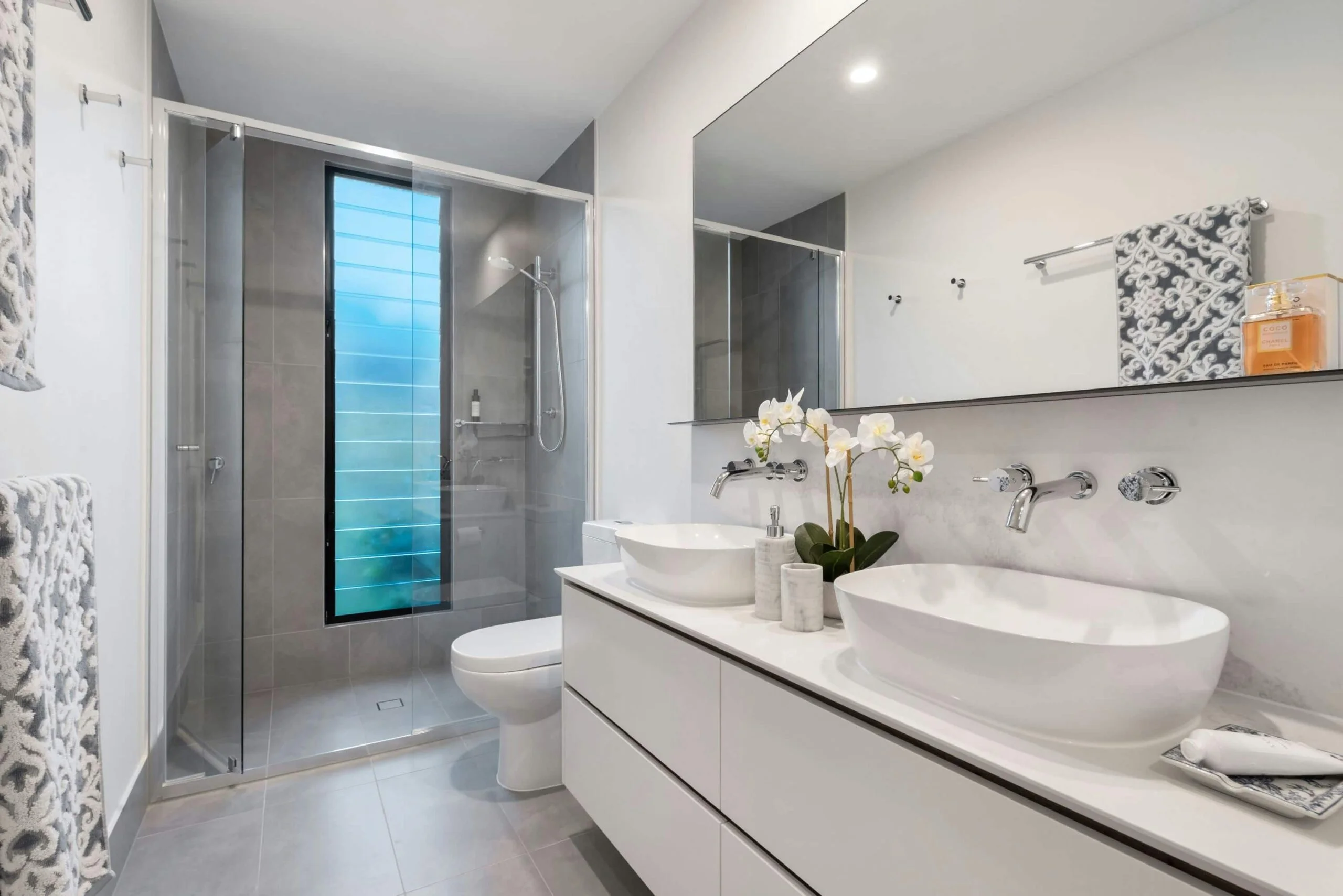 Modern bathroom with grey floor tiles